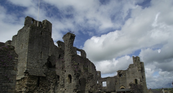 Photo of Middleham Castle - view of the east side, including the remains of the Keep, the Chapel and the Gatehouse. Photo Credit K P Lewis