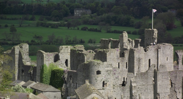 Photo of Middleham Castle - view of the south west and Prince's Tower, from the old castle mound. Photo Credit K P Lewis